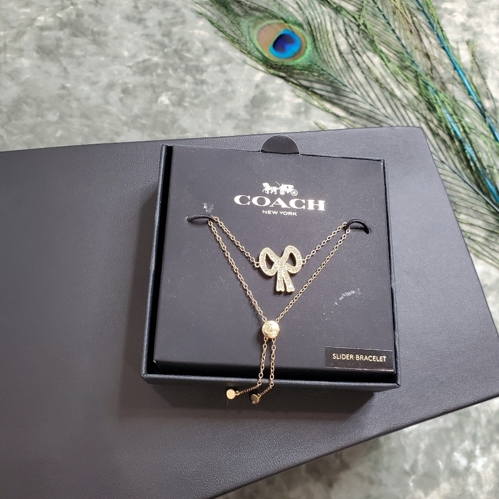 Coach Gold Tone Studded Bow Slider Bracelet
